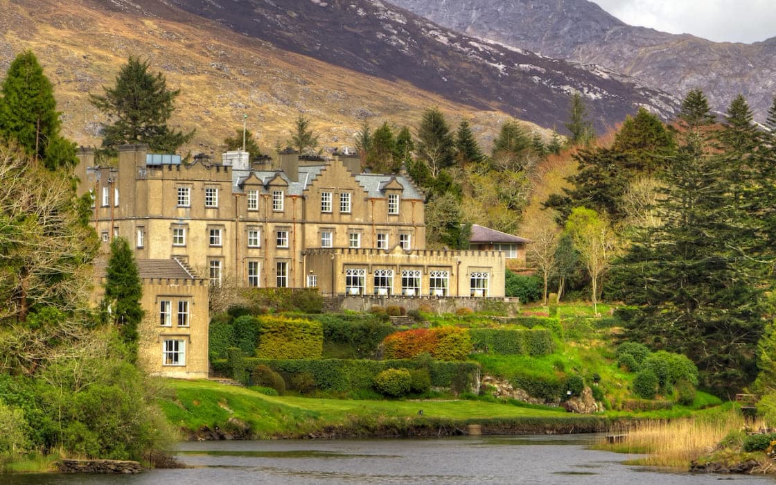 A country house on the river below the Connemara mountains