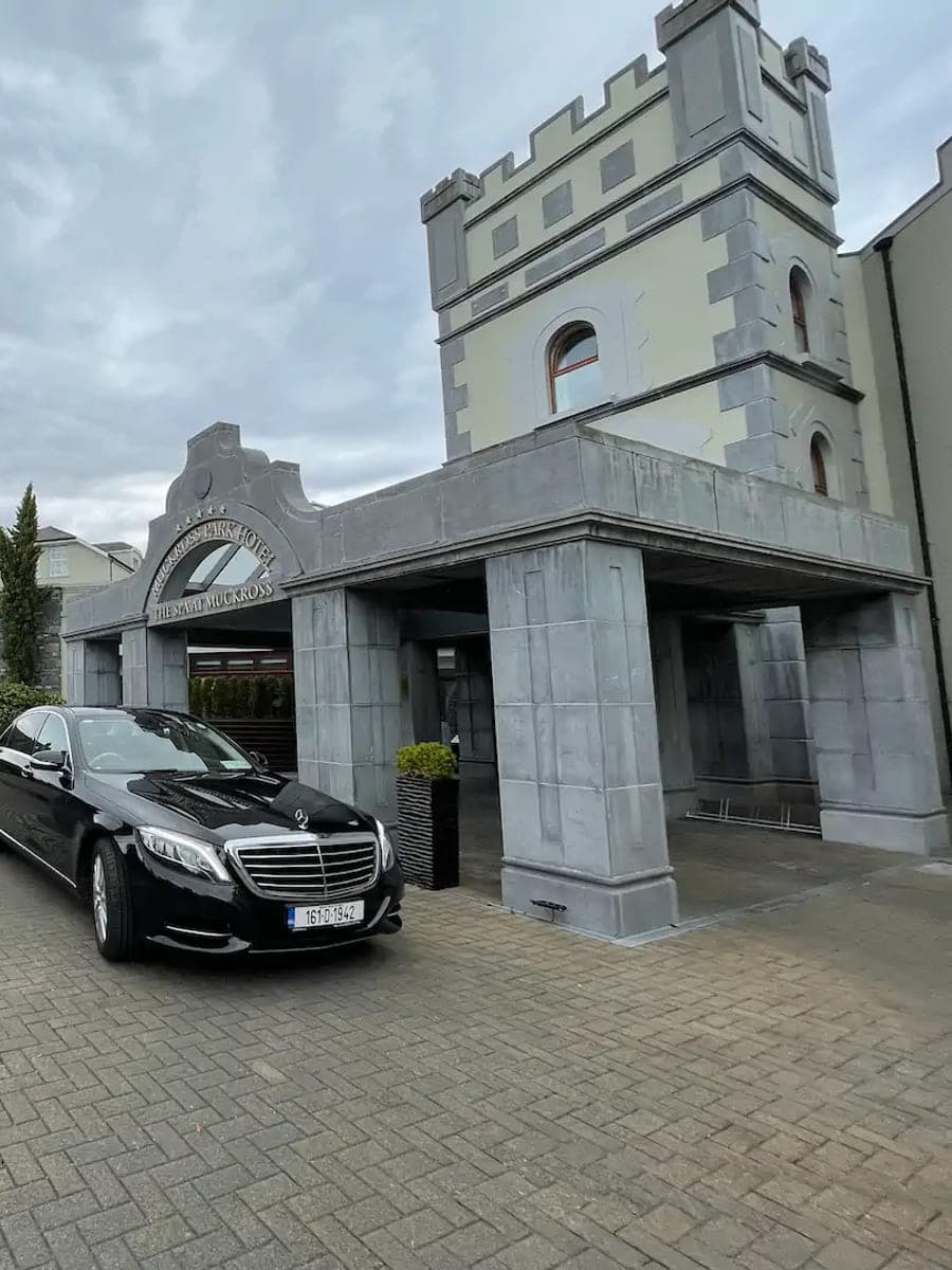 A TransferCabs saloon waiting at a hotel entrance in Killarney, County Kerry