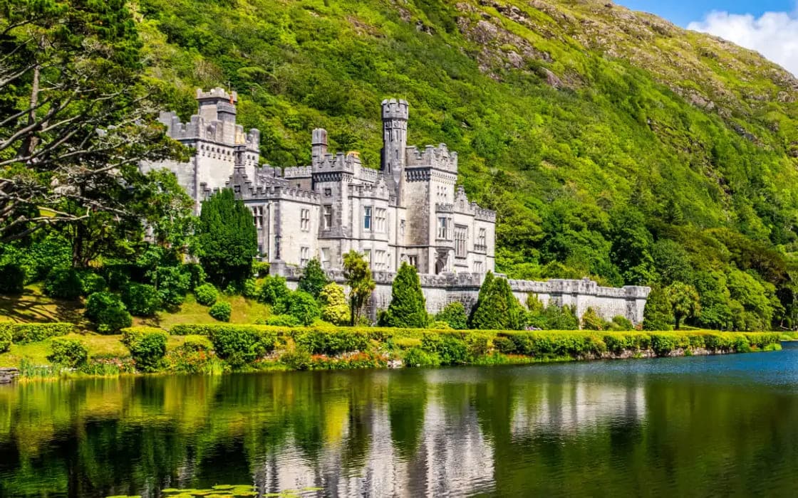 Kylemore Abbey on the lakeshore beneath the Connemara hills
